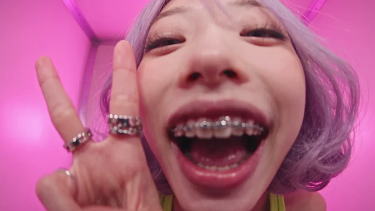 The same shot in both reels. Left, a one-off reference photo. Right, Yuki, the AI Blogger, with her bandana, braces and rings.